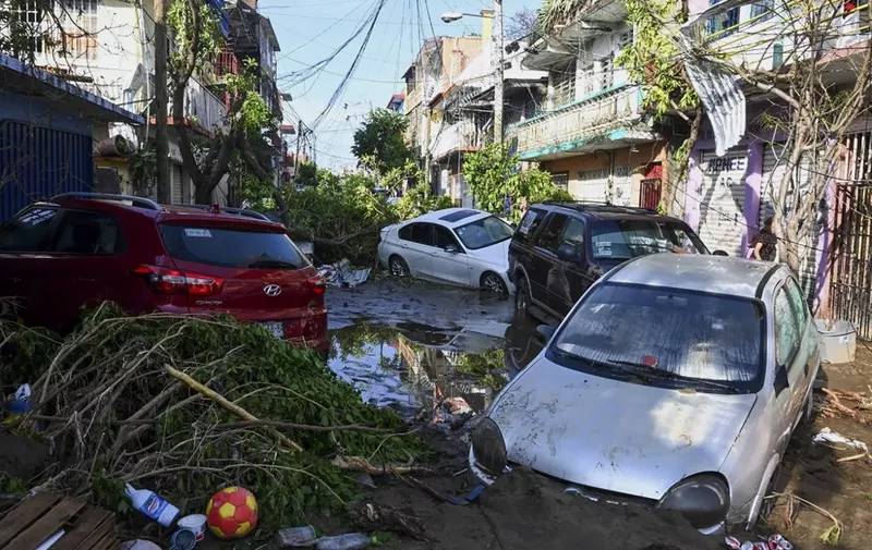 View of the damage caused after the passage of Hurricane Otis in Acapulco, Guerrero State, Mexico, taken on October 26, 2023. Hurricane Otis killed at least 27 people as it lashed Mexico's beach resort city of Acapulco as a scale-topping category 5 storm, officials said Thursday, in what residents called a "total disaster." (Photo by FRANCISCO ROBLES / AFP)