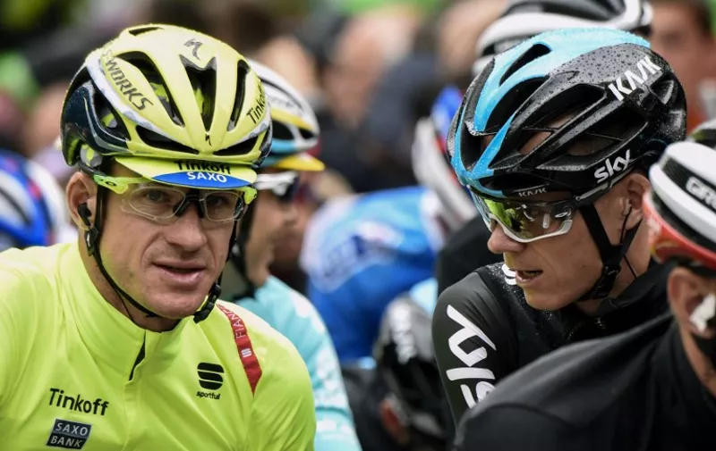 Australia's Michael Rogers (L) speaks with Great Britain's Christopher Froome prior to the start of the 189.5 km fifth stage of the 102nd edition of the Tour de France cycling race on July 8, 2015, between Arras and Amiens, northern France.   AFP PHOTO / ERIC FEFERBERG