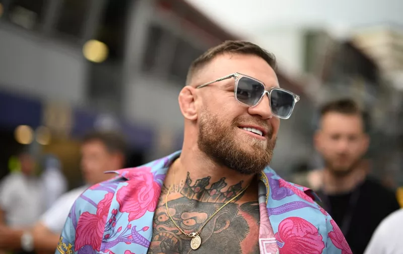 MMA (mixed martial arts) fighter Conor McGregor walks in the pit area after the qualifying  session at the Monaco street circuit in Monaco, ahead of the Monaco Formula 1 Grand Prix, on May 28, 2022. (Photo by CHRISTIAN BRUNA / POOL / AFP)