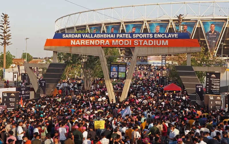 Spectators crowd to enter the Narendra Modi Stadium to watch the Indian Premier League (IPL) Twenty20 cricket match between Gujarat Titans and Rajasthan Royals in Ahmedabad on April 16, 2023. (Photo by Sam PANTHAKY / AFP)