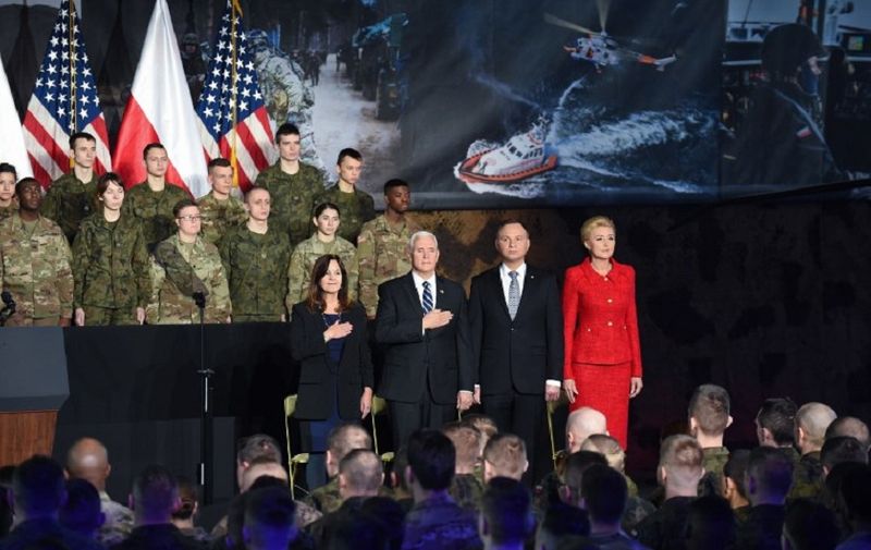 US Vice President Mike Pence (2L), his wife Karen Pence (L), Poland's President Andrzej Duda (2R) and his wife Agata Kornhauser-Duda attend a ceremony at the 1st Airlift Base in Warsaw, on February 13, 2019 during a three-day visit of the US Vice President to Poland. (Photo by Janek SKARZYNSKI / AFP)