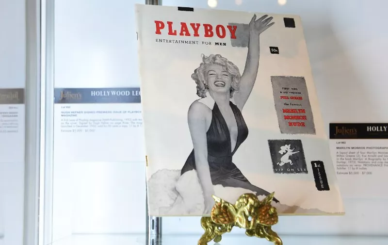 The first issue of Playboy magazine with Marilyn Monroe on the cover and signed by Hugh Hefner on page three is displayed at Julien's Auction House in Beverly Hills, California on June 22, 2015 ahead of Julien's "Hollywood Legends Auction" on June 26th and June 27th. Hefner launched Playboy in December 1953, selling for 50 cents a copy, with this issue estimated at $3,000 - $5,000.  AFP PHOTO/FREDERIC J. BROWN / AFP / FREDERIC J. BROWN