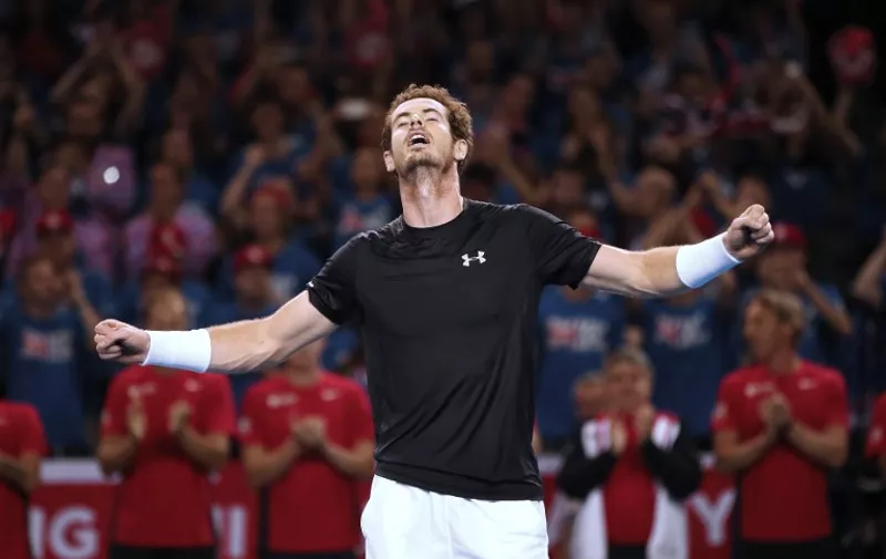 Andy Murray of Great Britain celebrates his victory during his reverse singles match against Bernard Tomic of Australia in the Davis Cup tennis semi-final between Great Britain and Australia in Glasgow, Scotland on September 20, 2015. AFP PHOTO / IAN MACNICOL