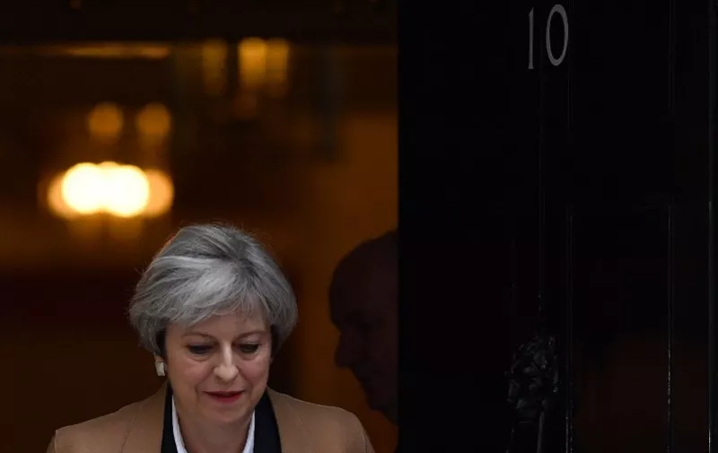 British Prime Minister Theresa May leaves 10 Downing Street before heading to the Houses of Parliament to attend the weekly Prime Minister's Questions (PMQs) in central London on March 29, 2017.
Britain formally launches the process for leaving the European Union on Wednesday, a historic step that has divided the country and thrown into question the future of the European unity project. / AFP PHOTO / Ben STANSALL