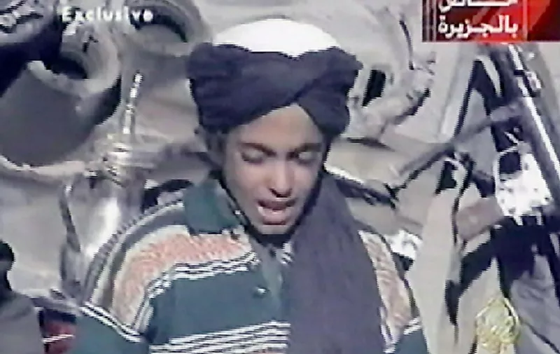 Hamza, who appears to be the youngest son of prime terror suspect Saudi born Osama bin Laden, recites a poem extolling Kabul and Mullah Mohammad Omar, supreme leader of Afghanistan's Taliban rulers, in this frame grab taken from the Qatar based al-Jazeera satellite news channel 07 November 2001. Bin Laden's four sons accompanying Taliban and "Afghan Arab" fighters on a search of a purported US base in central Afghanistan were shown on the news channel. Bin Laden is the suspected of being behind the 11 September 2001 suicide attack on two US cities. AFP PHOTO/AL-JAZEERA