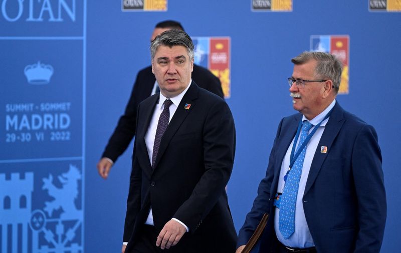 Croatia's President Zoran Milanovic (C) arrives for the NATO summit at the Ifema congress centre in Madrid, on June 30, 2022. (Photo by Pierre-Philippe MARCOU / AFP)