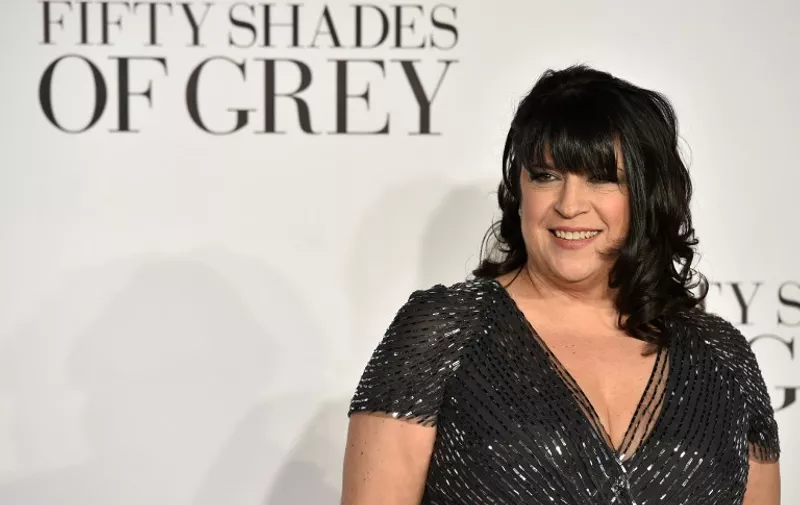 British author E.L James poses for photographers ahead of the UK Premiere of 'Fifty Shades of Grey' in central London on February 12, 2015. AFP PHOTO / LEON NEAL