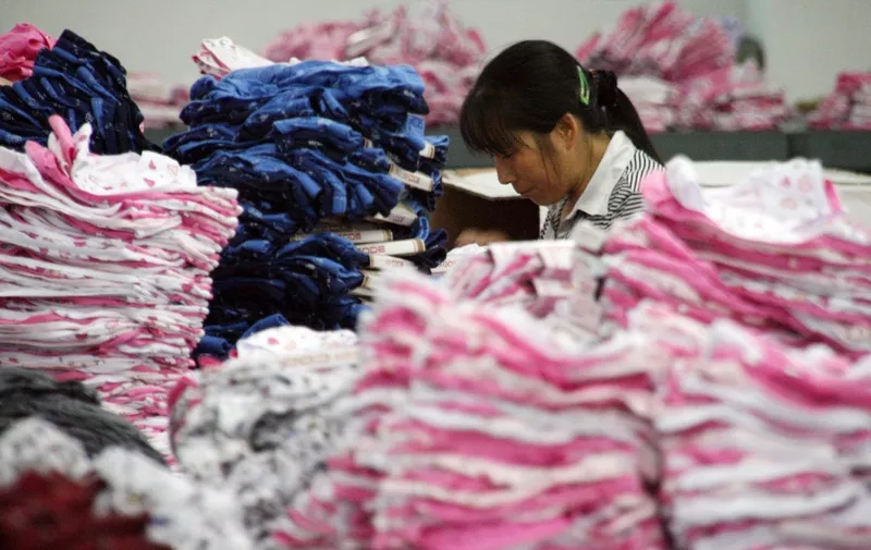 A Chinese worker sews undergarments at a textile factory in Jinjiang, southeast China's Fujian province on November 5, 2008. At least 2.7 million factory workers in southern China could lose their jobs as the global economic crisis hits demand for electronics, toys and clothes, as the region has seen massive export-driven expansion in recent years by supplying the world with cheap consumer goods, but rising production costs and falling US and European demand have marked a swift end to the boom.              CHINA OUT GETTY OUT        AFP PHOTO (Photo by AFP)