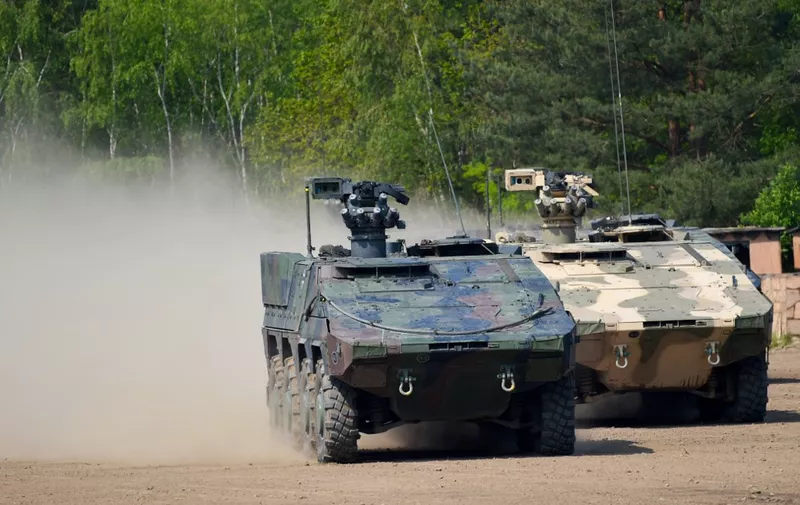 GTK Boxer armoured vehicle of the German armed forces Bundeswehr takes part in an educational practice of the "Very High Readiness Joint Task Force" (VJTF) as part of the NATO tank unit at the military training area in Munster, northern Germany, on May 20, 2019. (Photo by PATRIK STOLLARZ / AFP)