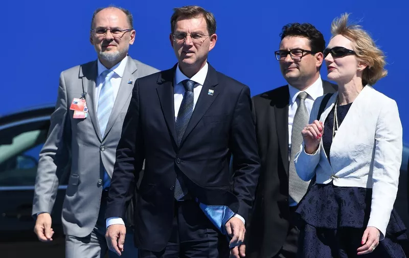 Slovenian Prime Minister Miro Cerar (C), followed by NATO's Slovenian Ambassador Jelko Kacin (rear L), arrives for the NATO (North Atlantic Treaty Organization) summit at the NATO headquarters, in Brussels, on May 25, 2017. (Photo by Emmanuel DUNAND / AFP)