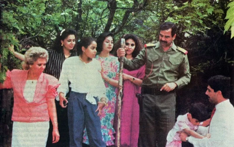This phot, distributed in the Iraqi press 29 February, shows Iraqi President Saddam Hussein (R) with his three daughters, from left to right Raghad (the eldest daughter), Hala (the younger) and Rana for the first time after the assassination of Saddam Hussein's two sons-in-law. The woman (2nd R) is an unidentified member of the family. / AFP PHOTO / ARCHIVES / AFP PHOTO STR