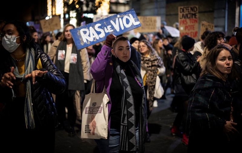 Protesters are pictured during a demonstration organised by "Nous Toutes" (All of Us), a French feminist collective, against sexist and violence to women during the international day for the elimination of violence against women in Toulouse on November 25, 2021. (Photo by Lionel BONAVENTURE / AFP)