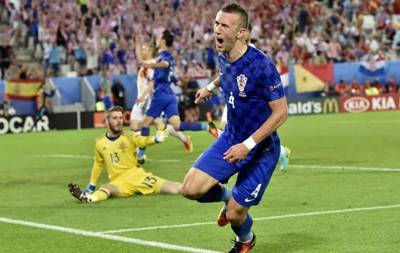 Croatia's midfielder Ivan Perisic celebrates his goal during the Euro 2016 group D football match between Croatia and Spain at the Matmut Atlantique stadium in Bordeaux on June 21, 2016. / AFP PHOTO / GEORGES GOBET