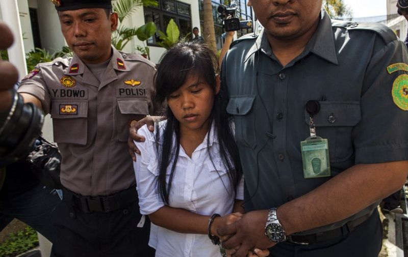 Philippine convicted drug smuggler on death row Mary Jane Fiesta Veloso, is escorted by Indonesian police as she arrives at the court in Sleman in central Java island for a hearing of judicial review on March 3, 2015 after a plea for clemency was rejected by Indonesian President Joko Widodo. A Frenchman, two Australians, Brazilian and a Filipino are among a group of foreigners, who have lost their appeals for clemency and are facing imminent execution. Brazil and France have also been ramping up pressure on Jakarta, with Paris summoning Indonesia's envoy and the Brazilian president refusing to accept the credentials of the new Indonesian ambassador. AFP PHOTO / SURYO WIBOWO