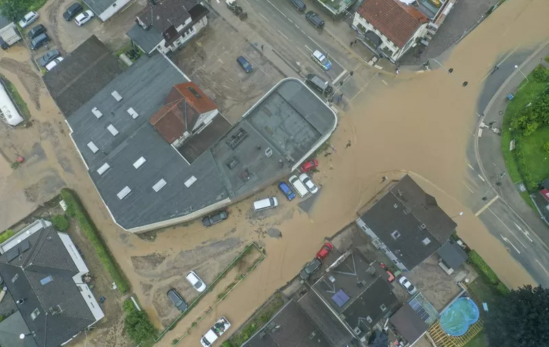 An aerial view taken on on July 14, 2021 shows a flooded intersection in Hagen, western Germany, after heavy rain hit parts of the country, causing widespread flooding. (Photo by INA FASSBENDER / AFP)