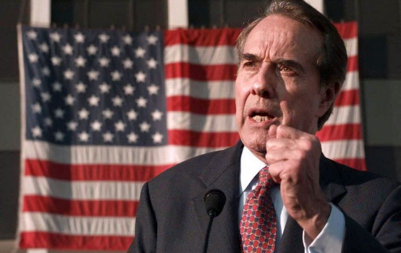 (FILES) In this file photo taken on February 25, 1996 Republican presidential hopeful US Senator Bob Dole speaks in Columbus, Georgia. - Dole, who battled back from severe injuries in World War II to become a five-term US senator and the Republican Party's 1996 presidential nominee, died on December 5, 2021, his family foundation announced. He was 98. "It is with heavy hearts we announce that Senator Robert Joseph Dole died early this morning in his sleep," the Elizabeth Dole Foundation tweeted. (Photo by J. DAVID AKE / AFP)