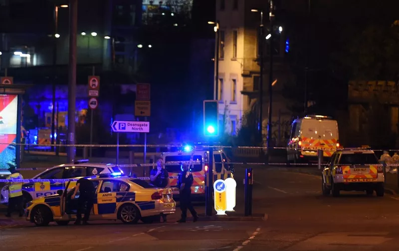 Police deploy at scene of a reported explosion during a concert in Manchester, England, on May 23,  2017. - British police said early May 23 there were "a number of confirmed fatalities" after reports of at least one explosion during a pop concert by US singer Ariana Grande. Ambulances were seen rushing to the Manchester Arena venue and police added in a statement that people should avoid the area. (Photo by PAUL ELLIS / AFP)