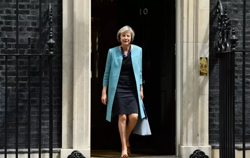 (FILES) This file photo taken on June 27, 2016 shows British Home Secretary Theresa May walking through the door of 10 Downing Street after attending a cabinet meeting at 10 Downing Street in central London.
Theresa May became the sole contender to become Britain's next prime minister on Monday after her sole rival pulled out in a dramatic twist as turmoil sweeps the political scene in the wake of the Brexit vote. Andrea Leadsom, who had come in for heavy criticism after appearing to imply that she was more qualified than May because she had children, said a lengthy leadership race would be "highly undesirable". / AFP PHOTO / LEON NEAL