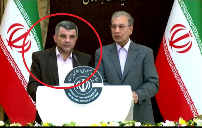 An image grab from footage obtained from the state-run Iran Press news agency on February 24, 2020, shows Iran's government spokesman Ali Rabiei (R) and deputy health minister Iraj Harirchi speaking during a press conference in Tehran. - Iran's deputy health minister confirmed on on February 25, that he has tested positive for the new coronavirus, amid a major outbreak in the Islamic republic. Harirchi coughed occasionally and appeared to be sweating during a press conference in Tehran with government spokesman Ali Rabiei. (Photo by - / IRAN PRESS / AFP) / RESTRICTED TO EDITORIAL USE - MANDATORY CREDIT - AFP PHOTO / HO / IRAN PRESS NO MARKETING NO ADVERTISING CAMPAIGNS - DISTRIBUTED AS A SERVICE TO CLIENTS FROM ALTERNATIVE SOURCES, AFP IS NOT RESPONSIBLE FOR ANY DIGITAL ALTERATIONS TO THE PICTURE'S EDITORIAL CONTENT, DATE AND LOCATION WHICH CANNOT BE INDEPENDENTLY VERIFIED  - NO RESALE - NO ACCESS ISRAEL MEDIA/PERSIAN LANGUAGE TV STATIONS/ OUTSIDE IRAN/ STRICTLY NO ACCESS BBC PERSIAN/ VOA PERSIAN/ MANOTO-1 TV/ IRAN INTERNATIONAL /
