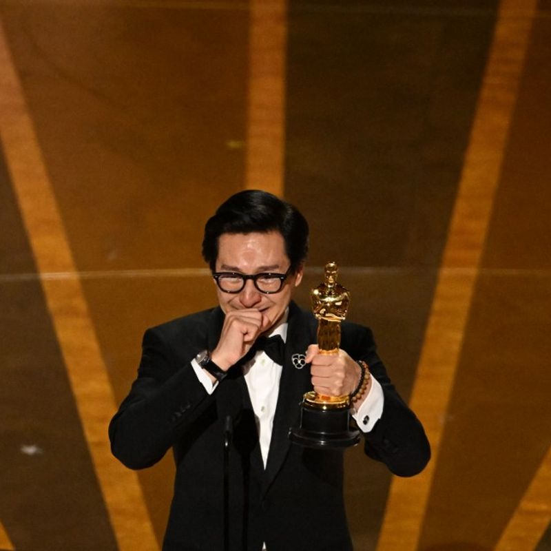 US-Vietnamese actor Ke Huy Quan accepts the Oscar for Best Actor in a Supporting Role for "Everything Everywhere All at Once" onstage during the 95th Annual Academy Awards at the Dolby Theatre in Hollywood, California on March 12, 2023. (Photo by )