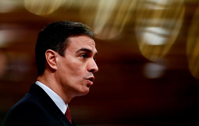 Spanish Prime Minister Pedro Sanchez delivers a speech during a session at the Lower Chamber in Madrid on March 25, 2020 to debate the extension of a national lockdown until April 11 in an effort to slow down the spread of the COVID-19 coronavirus. - As the global death toll soared past 20,000, Spain joined Italy in seeing its number of fatalities overtake China, where the virus first emerged just three three months ago. (Photo by Mariscal / various sources / AFP)