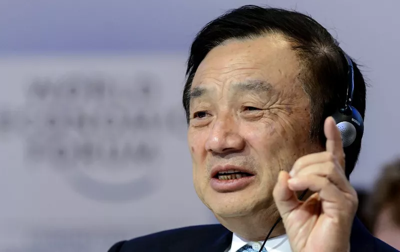 (FILES) This file picture taken on January 22, 2015 shows Huawei Founder and CEO Ren Zhengfei gesturing as he attends a session of the World Economic Forum (WEF) annual meeting in Davos. - Huawei founder Ren Zhengfei on May 21, 2019 shrugged off US attempts to block his company's global ambitions, saying the United States underestimates the telecom giant as it is ready to withstand the impact. (Photo by FABRICE COFFRINI / AFP)