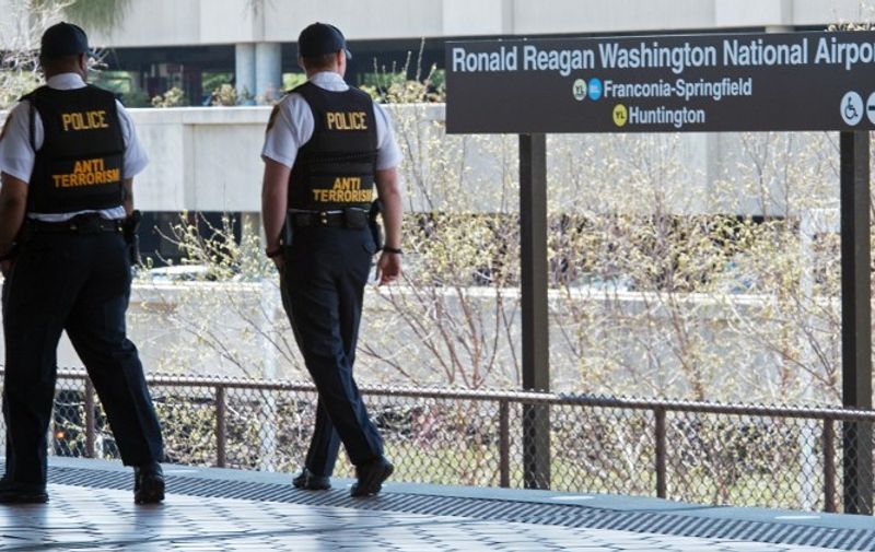 The Washington Metropolitan Area Transit Authority (METRO) Transit Police Officers patrol on a platform at the Ronald Reagan National Airport in Washington, DC on April 13, 2015.     AFP PHOTO/PAUL J. RICHARDS / AFP PHOTO / PAUL J. RICHARDS