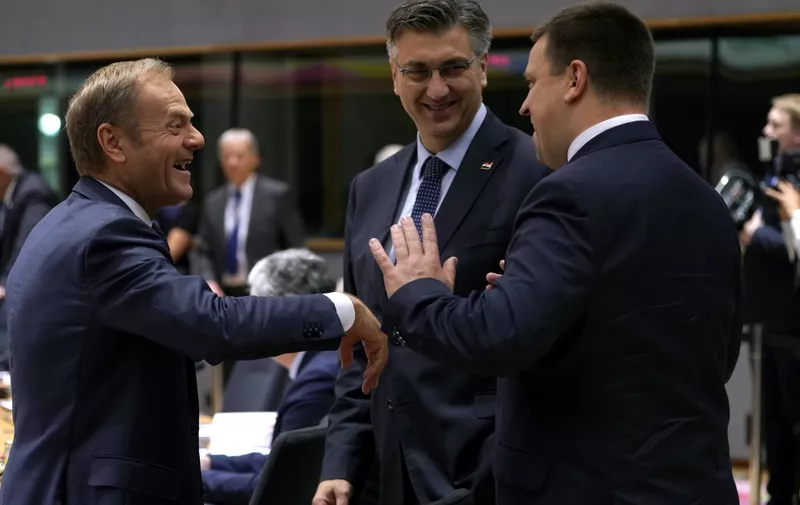 (FromL) European Council President Donald Tusk, Croatia's Prime Minister Andrej Plenkovic and Estonia's Prime Minister Juri Ratas talk prior to a meeting during an EU summit at the Europa building in Brussels, on June 21, 2019. - European leaders early on June 21, 2019 failed to agree on a new top team to lead efforts to reform their union for 2019-2024, and postponed a decision until the end of June. (Photo by Kenzo TRIBOUILLARD / AFP)