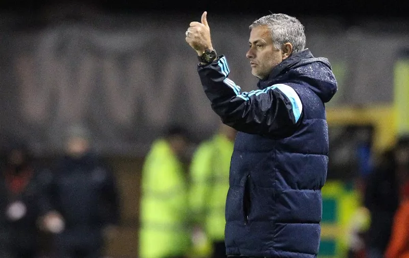 Chelsea's Portuguese manager Jose Mourinho gives the thumbs-up to his players after their 2-1 win during the English League Cup round four football match between Shrewsbury Town and Chelsea at the Greenhous Meadow stadium in Shrewsbury, West Midlands, England, on October 28, 2014. AFP PHOTO / 

RESTRICTED TO EDITORIAL USE. No use with unauthorized audio, video, data, fixture lists, club/league logos or "live" services. Online in-match use limited to 45 images, no video emulation. No use in betting, games or single club/league/player publications.