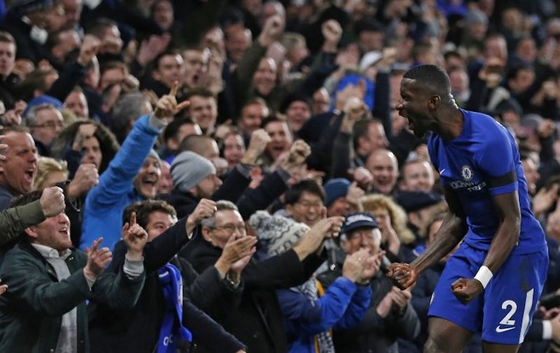 Chelsea's German defender Antonio Rudiger celebrates after scoring the opening goal of the English Premier League football match between Chelsea and Swansea City at Stamford Bridge in London on November 29, 2017. (Photo by Ian KINGTON / AFP) / RESTRICTED TO EDITORIAL USE. No use with unauthorized audio, video, data, fixture lists, club/league logos or 'live' services. Online in-match use limited to 75 images, no video emulation. No use in betting, games or single club/league/player publications. /