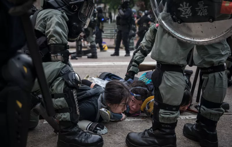 HONG KONG, CHINA - SEPTEMBER 29: Pro-democracy protesters are arrested by police during clashes after a march on September 29, 2019 in Hong Kong, China. Pro-democracy demonstrations have entered its fourth month as Hong Kong braces for the 70th anniversary of the founding of the People's Republic of China with a series of pro and anti-Beijing protests scheduled towards October 1. Anti-government protesters have continued its call for Chief Executive Carrie Lam to meet their remaining demands, including an independent inquiry into police brutality, the retraction of the word “riot” to describe the rallies, and genuine universal suffrage. (Photo by Chris McGrath/Getty Images)