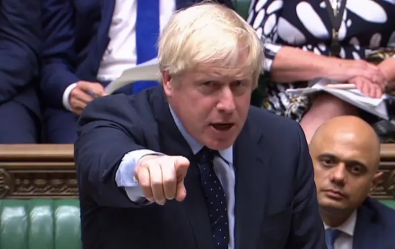 A video grab from footage broadcast by the UK Parliament's Parliamentary Recording Unit (PRU) shows Britain's Prime Minister Boris Johnson as he stands a thte dispatch box and speaks in the House of Commons in London on September 3, 2019, as he gives a statement on the recent G7 meeting. - Prime Minister Boris Johnson was braced for a showdown with parliament on Tuesday over his Brexit plan that could spark a snap election and derail Britain's exit from the European Union next month. (Photo by - / PRU / AFP) / RESTRICTED TO EDITORIAL USE - MANDATORY CREDIT " AFP PHOTO / PRU " - NO USE FOR ENTERTAINMENT, SATIRICAL, MARKETING OR ADVERTISING CAMPAIGNS - EDITORS NOTE THE IMAGE HAS BEEN DIGITALLY ALTERED AT SOURCE TO OBSCURE VISIBLE DOCUMENTS