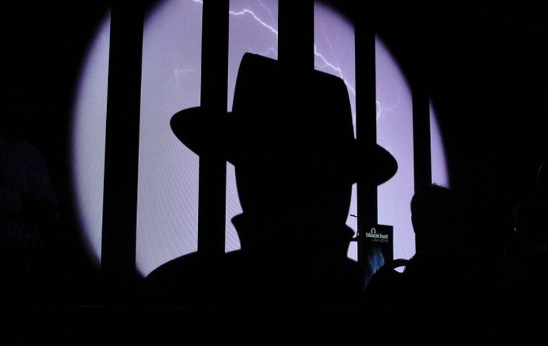 With AFP Story by Glenn CHAPMAN: US-IT-INTERNET-SOFTWARE-HACKING-AUTOMOBILE-BLACKHAT
A Black Hat logo shines from the stage in advance of briefings August 5, 2015 at the major cyber security conference in Las Vegas.  The ability to seize data or control from once-dumb devices turned smart with wireless Internet connections was a hot topic during a premier Black Hat cyber security conference.   AFP PHOTO / GLENN CHAPMAN / AFP PHOTO / GLENN CHAPMAN
