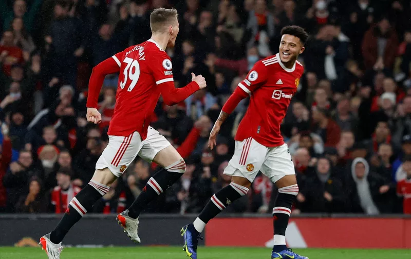 Soccer Football - Premier League - Manchester United v Burnley - Old Trafford, Manchester, Britain - December 30, 2021
Manchester United's Scott McTominay celebrates scoring their first goal with Jadon Sancho REUTERS/Phil Noble EDITORIAL USE ONLY. No use with unauthorized audio, video, data, fixture lists, club/league logos or 'live' services. Online in-match use limited to 75 images, no video emulation. No use in betting, games or single club	/league/player publications.  Please contact your account representative for further details.