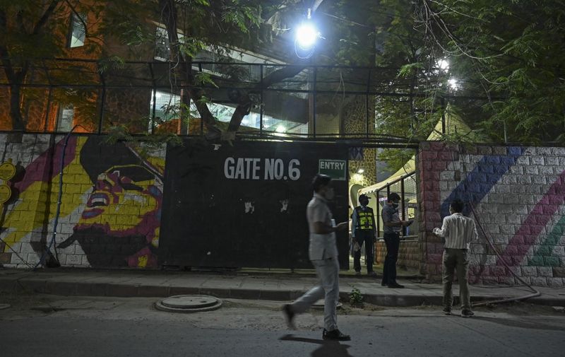A policeman walks outside the Arun Jaitley Stadium in New Delhi on April 28, 2021 during the 2021 Indian Premier League (IPL) Twenty20 cricket match between the Sunrisers Hyderabad and the Chennai Superkings with no spectators in attendance due to the Covid-19 coronavirus pandemic. (Photo by TAUSEEF MUSTAFA / AFP)