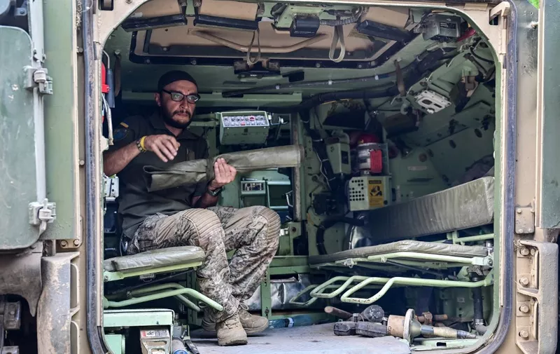 UKRAINE - SEPTEMBER 6, 2023 - Gunner 'Molfar', 39, a Bradley IFV crew member of the 47th Magura Mechanized Brigade who took part in the fighting to liberate Robotyne village from Russian invaders, is seen inside the vehicle, Zaporizhzhia direction, southeastern Ukraine. NO USE RUSSIA. NO USE BELARUS. (Photo by Ukrinform/NurPhoto) (Photo by Dmytro Smolienko / NurPhoto / NurPhoto via AFP)