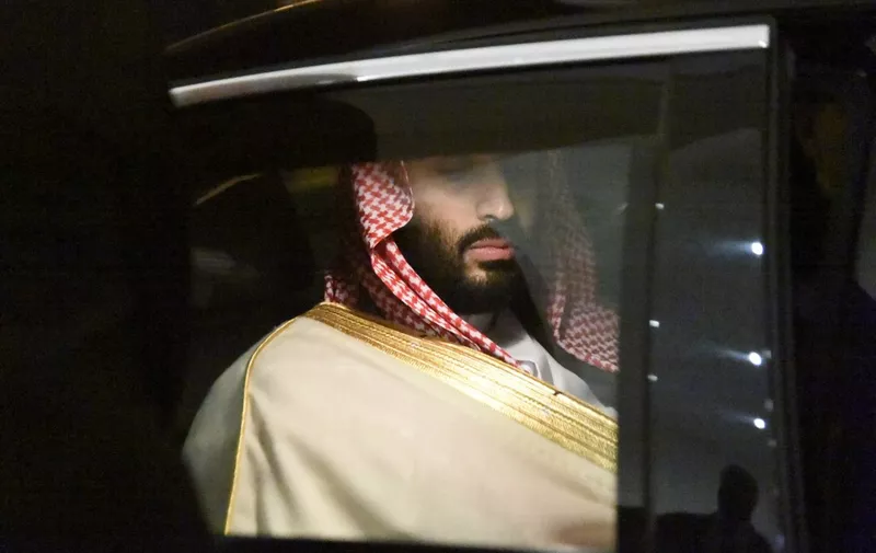 Saudi Crown Prince Mohammed bin Salman is driven to a meeting with Algerian Prime Minister upon the former's arrival at Algiers on December 2, 2018. (Photo by RYAD KRAMDI / AFP)