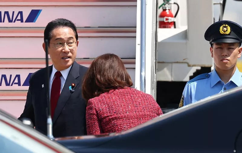 Japanese Prime Minister Fumio Kishida and his spouse Yuko board a government plane heading for Hiroshima to attend the G7 summit at Haneda Airport in Tokyo on May 18, 2023. ( The Yomiuri Shimbun ) (Photo by Koki Kataoka / Yomiuri / The Yomiuri Shimbun via AFP)