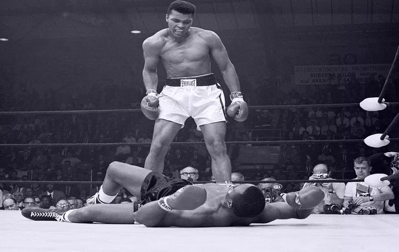 In this May 25, 1965, heavyweight champion Muhammad Ali stands over Sonny Liston and taunts him to get up during their title fight. Ali knocked Liston out in one minute in the first round during their bout at the Central Maine Youth Center in Lewiston, Maine., Image: 52846778, License: Rights-managed, Restrictions: HODELETE NC NO MAGAZINE [&hellip;]