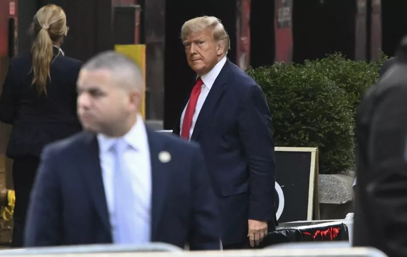 Former US President Donald Trump arrives at Trump Tower in New York on April 3, 2023. - Trump arrived on April 3, 2023 in New York where he will surrender to unprecedented criminal charges, taking America into uncharted and potentially volatile territory as he seeks to regain the presidency. The 76-year-old Republican, the first US president ever to be criminally indicted, will be formally charged Tuesday over hush money paid to a porn star during the 2016 election campaign. (Photo by Ed JONES / AFP)