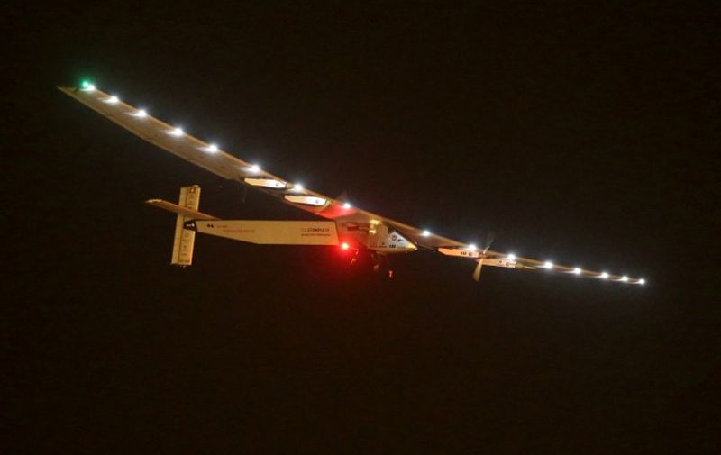 Solar Impulse 2 is seen prior landing at the Nanjing Lukou International Airport in Nanjing, east China's Jiangsu province, on April 21, 2015. Solar Impulse 2 landed late on April 21 in the Chinese city of Nanjing, finishing the sixth stage of its landmark 12-leg quest to circumnavigate the globe powered only by the sun. With pilot Bertrand Piccard at the controls, the pioneering single-seater aircraft touched down at 11:31 pm (1531 GMT), after a 17-hour trip from the southwestern megacity of Chongqing some 1,190 kilometres away. AFP PHOTO -- CHINA OUT