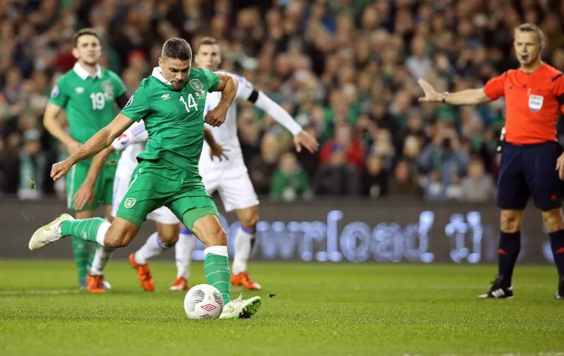 Ireland's striker Jonathan Walters shoots to score his team's first goal, from a penalty during a UEFA Euro 2016 Group D qualifying second leg play-off football match between Ireland and Bosnia Herzegovina at the Aviva stadium in Dublin on November 16, 2015.  AFP PHOTO / PAUL FAITH