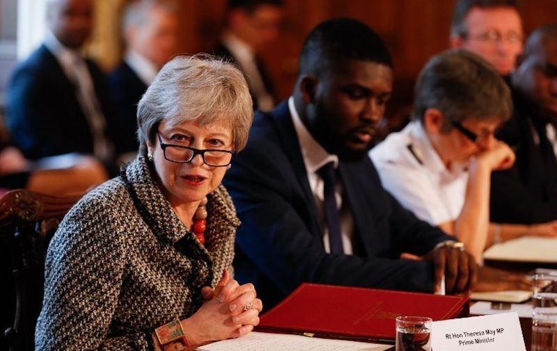 Britain's Prime Minister Theresa May (L) hosts a Serious Youth Violence Summit next to Youth Justice Board co-chair Roy Sefa-Attakora (C) and Metropolitan Police commissioner Cressida Dick (R) at 10 Downing Street in central London on April 1, 2019. - The prime minister hosted a meeting attended by the London Mayor Sadiq Khan, Metropolitan Police commissioner Cressida Dick, MPs and others on youth violence at Downing Street, following a spate of teenage stabbing murders. Government figures showed earlier this year that the number of fatal stabbings in England and Wales had risen to its highest level since records started more than 70 years ago. (Photo by Adrian DENNIS / POOL / AFP)