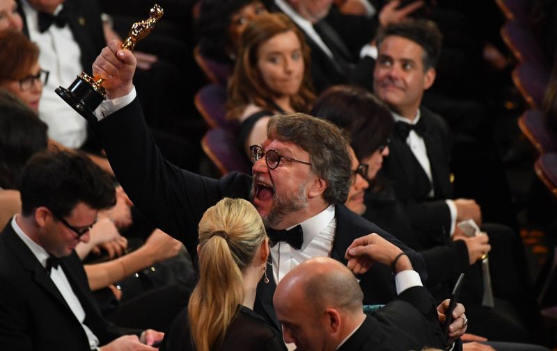 March 4, 2018; Hollywood, CA, USA; Guillermo del Toro celebrates after winning the Oscar for achievement in directing for "The Shape of Water" from Emma Stone during the 90th Academy Awards at Dolby Theatre., Image: 365082682, License: Rights-managed, Restrictions: *** World Rights *** No Tabloids ***, Model Release: no, Credit line: Profimedia, SIPA USA
