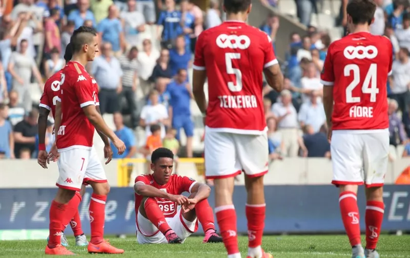 Standard's players look dejected after they lost 7-1 in the Jupiler Pro League football match between Club Brugge KV and Standard de Liege, in Brugge, on August 30, 2015, on the 6th day of the Belgian soccer championship. AFP PHOTO / BELGA /  BRUNO FAHY  =BELGIUM OUT=