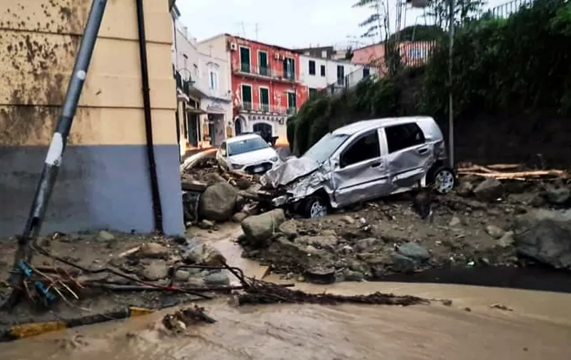 Destroyed cars are picturedin Casamicciola in the southern Ischia island on November 26, 2022, following heavy rains that sparked a landslide. - Italy's interior minister said there had been no confirmed deaths in a landslide on November 26, 2022 on the island of Ischia, despite earlier reports of eight killed. (Photo by ANSA / Ansa / AFP) / Italy OUT