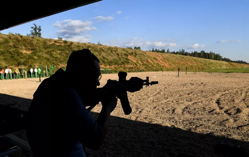 A visitor shoots from AK-202 automatic rifle in the Kalashnikov shooting centre prior the International Military-Technical Forum Army-2020 in the military Patriot Park outside Moscow on August 21, 2020. (Photo by Kirill KUDRYAVTSEV / AFP)