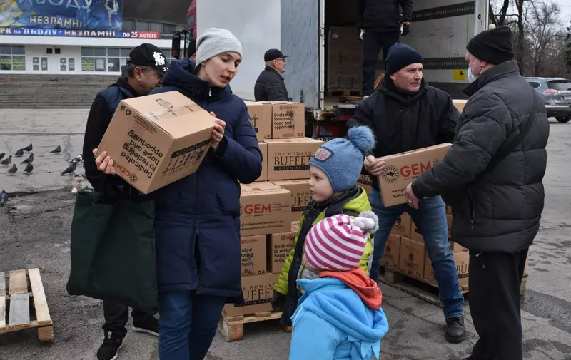 Internally displaced civilians receive humanitarian aid distributed in Zaporizhzhia on February 6, 2024, amid the Russian invasion of Ukraine. (Photo by Andriy ANDRIYENKO / AFP)