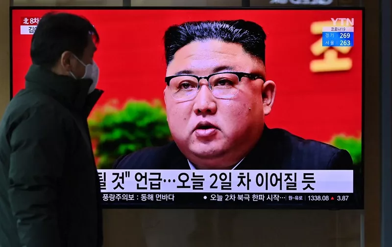 A man watches a television screen showing news footage of North Korean leader Kim Jong Un attending the 8th congress of the ruling Workers' Party held in Pyongyang, at a railway station in Seoul on January 6, 2021. (Photo by Jung Yeon-je / AFP)