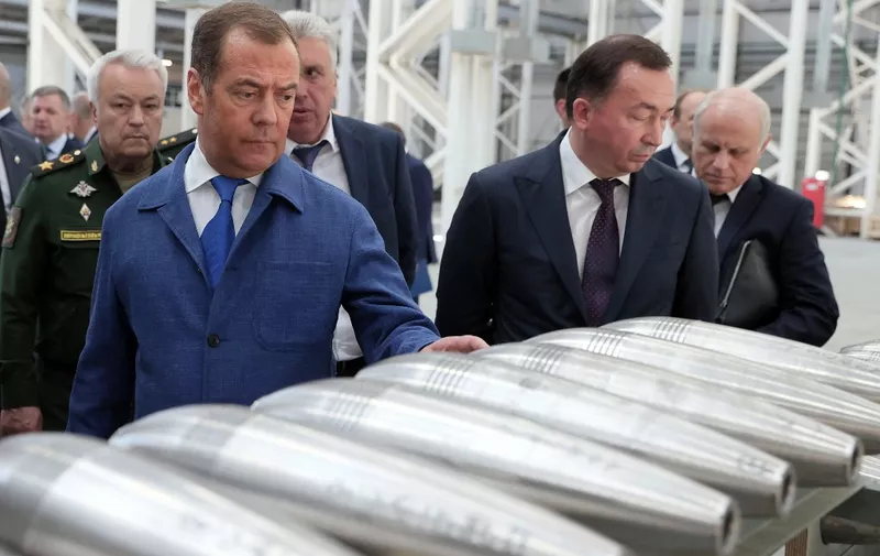 Russia's former leader Dmitry Medvedev, a President Putin ally who is now deputy chairman of the country's security council, visits the Aleksin Experimental Mechanical Plant in the Tula region on June 15, 2023. (Photo by Yekaterina SHTUKINA / SPUTNIK / AFP)